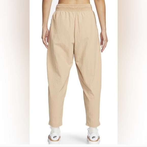 NIKE Women's Sportswear Essential Woven High-Waisted Curve Pants. Tan/cream. XS - Picture 2 of 14